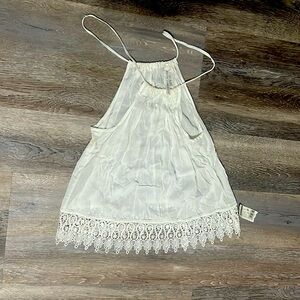 Cute tank with lace detail around bottom
